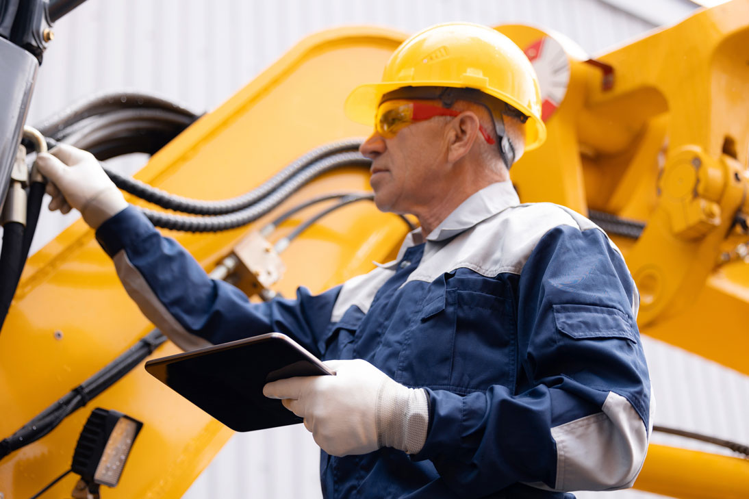 Employee controls hydraulic